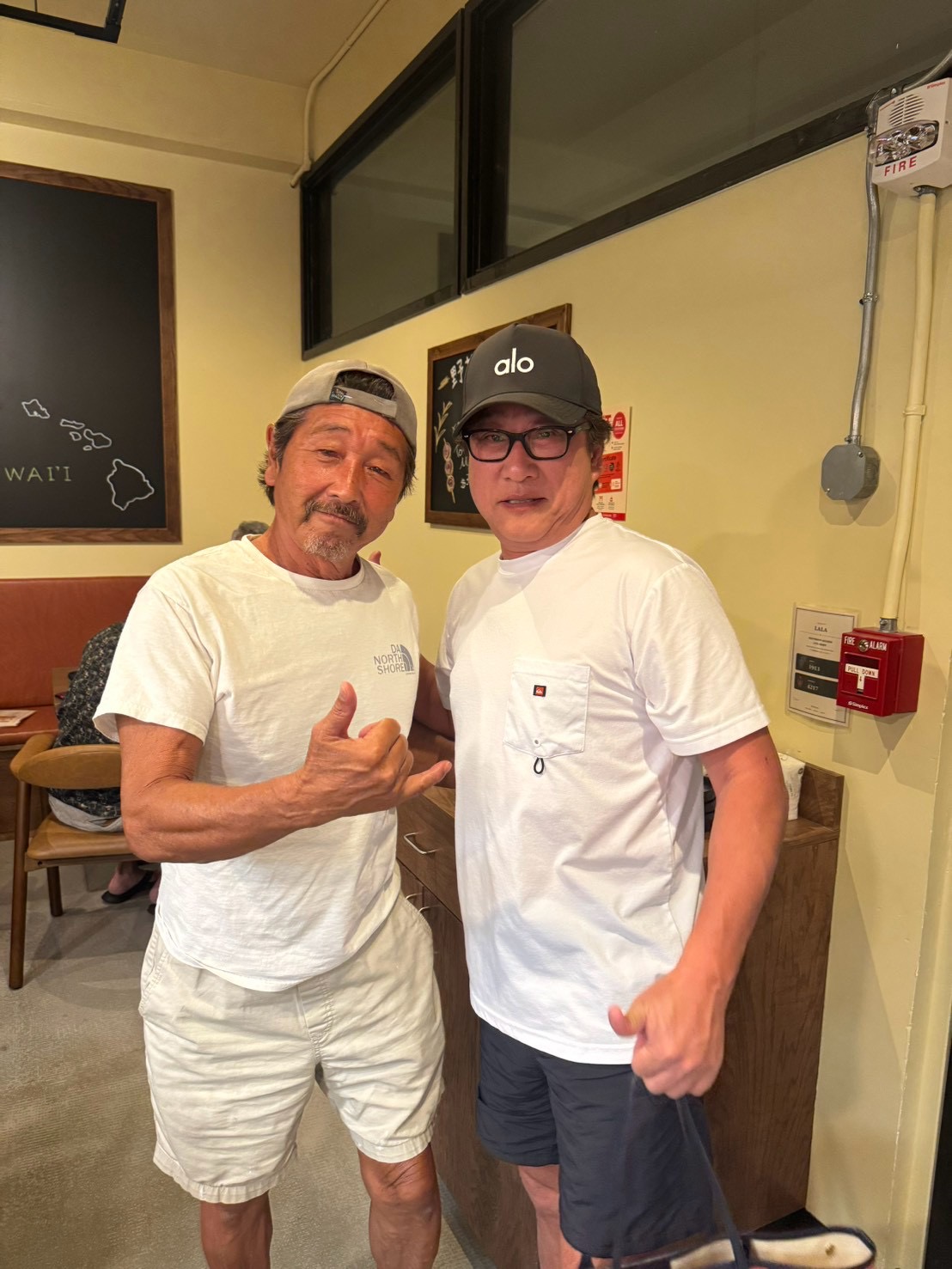 Two people posing together inside LaLa.