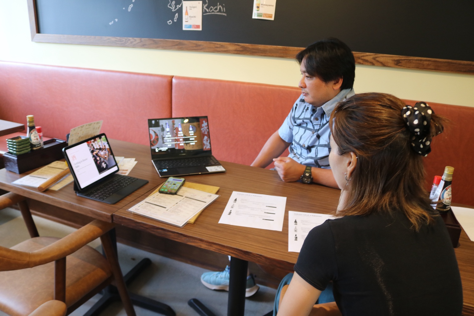 Learning about the breweries through videos and conversation.