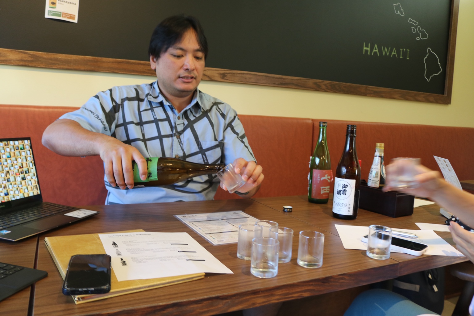 Sharing sake and ideas around the table at LaLa.