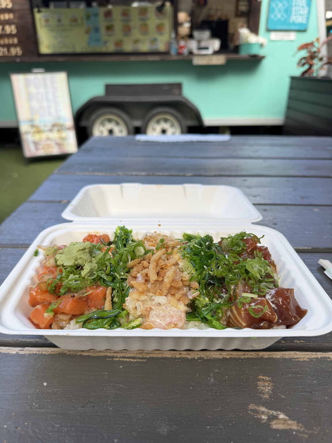 Five Star Poke bowl in front of the Waikiki food truck